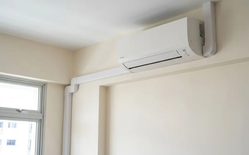 Completed aircon installation showing neat trunking and modern indoor unit in HDB living room
